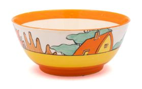 A Clarice Cliff pottery bowl, enamelled in the Orange Roof Cottage pattern, Bizarre backstamp, 17.