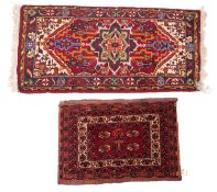 A Turkoman saddle bag, the madder field with four quartered octagons,