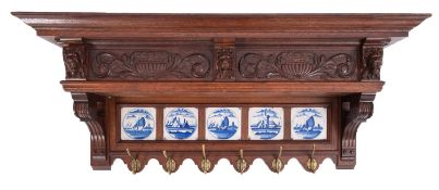 A set of Dutch oak and Delft tile inset wall mounted hanging hooks,