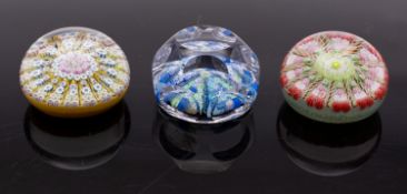A group of three millefiori glass paperweights including a Whitefriars faceted weight 7.