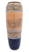 A Royal Doulton stoneware vase of slender oviform sgraffito decorated with a band of horses and