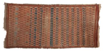 A Moroccan rug, the beige field with an all over design of flowerhead motifs,