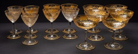 A part suite of glasses each intaglio decorated and gilt embellished with flowers and foliage above