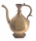 An Indian bronze ewer, 18th century the body cast with heart shaped motifs, on hexagonal base,