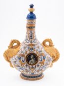Ulysses Cantagalli a majolica flask and stopper of flattened tear drop form with dragon handles