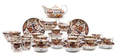An early 19th century Derby part tea coffee service, in an Imari pattern comprising a teapot,