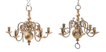 Two similar Dutch brass six light chandeliers,