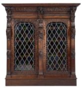 A carved oak and glazed side cabinet in Flemish 17th century taste,