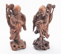 A pair of Chinese carved rootwood figures of the Immortal Li Tieguai late Qing Dynasty, circa 1900,