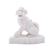 A small Chinese blanc-de-chine figure of a Buddhist lion, Qing dynasty early 18th century,