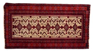 A Meshed Belouch rug, with central pole medallions in brick red, surrounded by animals and foliage,