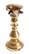 A brass four-light table oil lamp, 18th century; the open reservoir bowl top with four wick spouts,