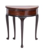 A George II mahogany demi-lume tea table, mid 18th Century; the flip top with brass hinges,