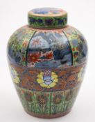 A Chinese blue and white oviform jar and cover with later 'clobbered' polychrome decoration with