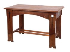 A set of seven oak chairs in Arts and Crafts style, early 20th century; including one elbow chair,