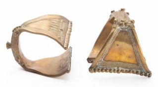 Two Indian brass cuff bracelets cast with studs, beads and diaper bands, 8 and 9cm wide.