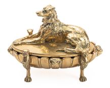 A French brass encrier cast with a recumbent hound,