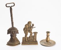 A Victorian brass door porter cast as a wheatsheaf,