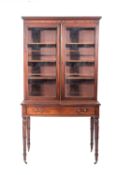 A Regency mahogany and glazed cabinet on stand,