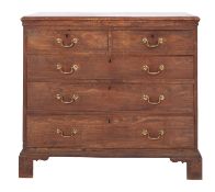 A George III stained exotic hardwood, possibly Chinese elm, chest of drawers,