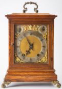 Winterhalder & Hofmeier, Germany, an oak quarter-striking mantel clock,