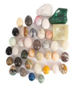 A collection of marble and other stone eggs, including examples in marmo Portoro, alabaster,