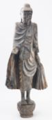 A large carved and stained wood standing figure of Buddha, 20th century, 92cm.