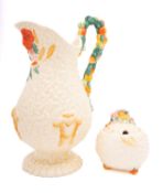 A Clarice Cliff Harvest pattern jug and sugar bowl, the bowl complete with lid, jug height 28cm.