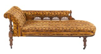 A Victorian walnut and upholstered chaise longue, in Aesthetic Movement style,