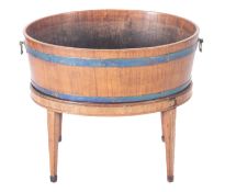 A 19th Century mahogany inlaid and brass bound oval wine cooler,