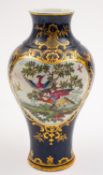 A First Period Worcester baluster vase painted with two panels of fancy birds in classical