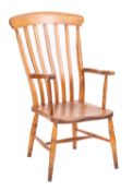A Victorian elm, beech and ash lath-back elbow chair,