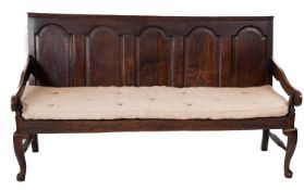 An oak panel back settle,