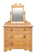 A painted pine dressing chest, circa 1900; the angle adjustable mirror in twin turned supports,