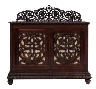 An Anglo Indian carved hardwood, possibly teak side cabinet,