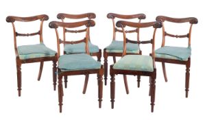 A set of six late Regency carved rosewood dining chairs,