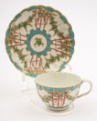 A First Period Worcester 'Hop Trellis' teacup and saucer of lobed form,