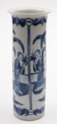 A Chinese porcelain sleeve vase painted in blue with four panels containing a lady in a garden