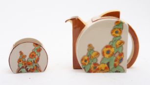 A Clarice Cliff Stamford shape teapot, cover and sugar bowl enamelled in the Sunshine pattern,