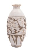 A Chinese Chizou pottery vase of slender oviform incised with a broad band of flowers and foliage