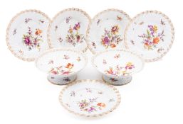 Five Dresden porcelain plates with two matching low comports each enamelled with bouquets,