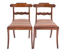 A pair of Regency carved rosewood and brass inlaid side chairs,