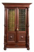 A Continental, probably Flemish oak and glazed cabinet, in early 17th century taste,