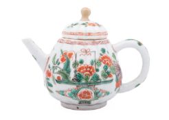 A small Chinese famille verte teapot and cover, Kangxi of ribbed form,