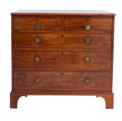 A George III mahogany chest of drawers, late 18th Century; the top with moulded edges,