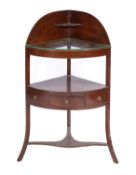 A Regency mahogany corner washstand; early 19th Century;