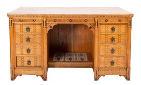 A Victorian oak and parquetry desk, in Aesthetic Movement taste, by Maple & Co.