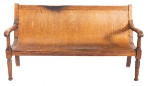 A late 19th Century beechwood and pierced bentwood settle,