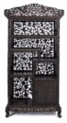 A Chinese carved and stained hardwood, probably zitan, open display cabinet,