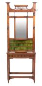 A Victorian oak and ceramic tile inset hallstand, in Arts & Crafts style,